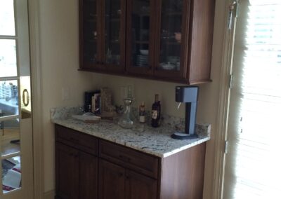 A modern kitchen featuring a sleek cabinet and a spacious counter, designed for functionality and style.