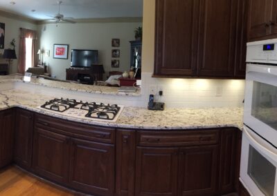 A well-appointed kitchen with a generous island and an elegant stove, emphasizing both practicality and aesthetics.